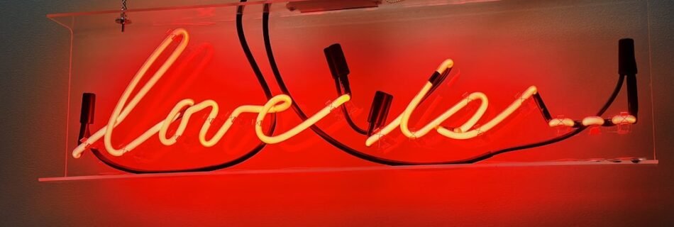 a neon sign that says boozie on it