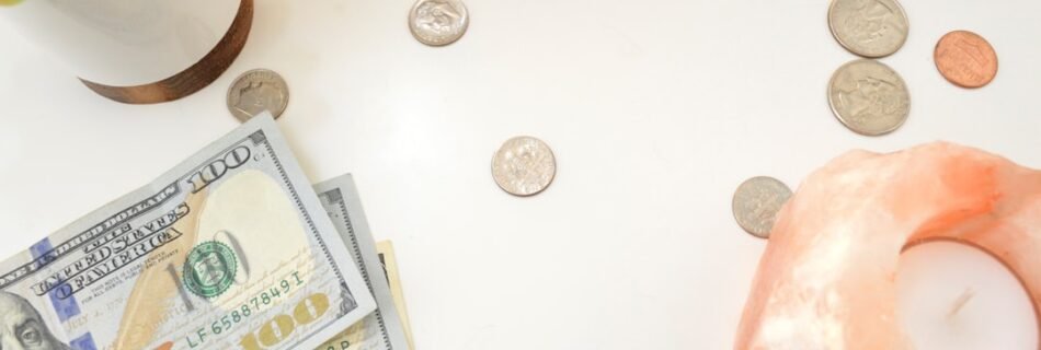 silver round coins on white table